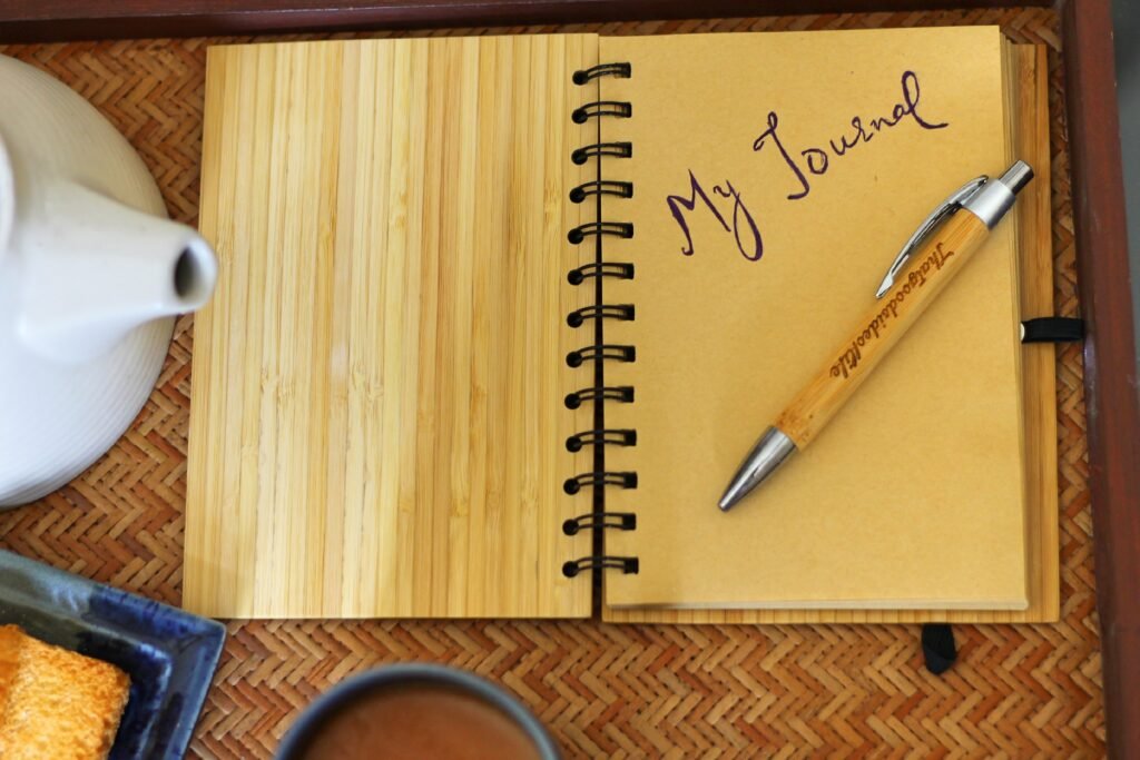 Atomic Habits book on a morning routine desk – books recommended by successful people.